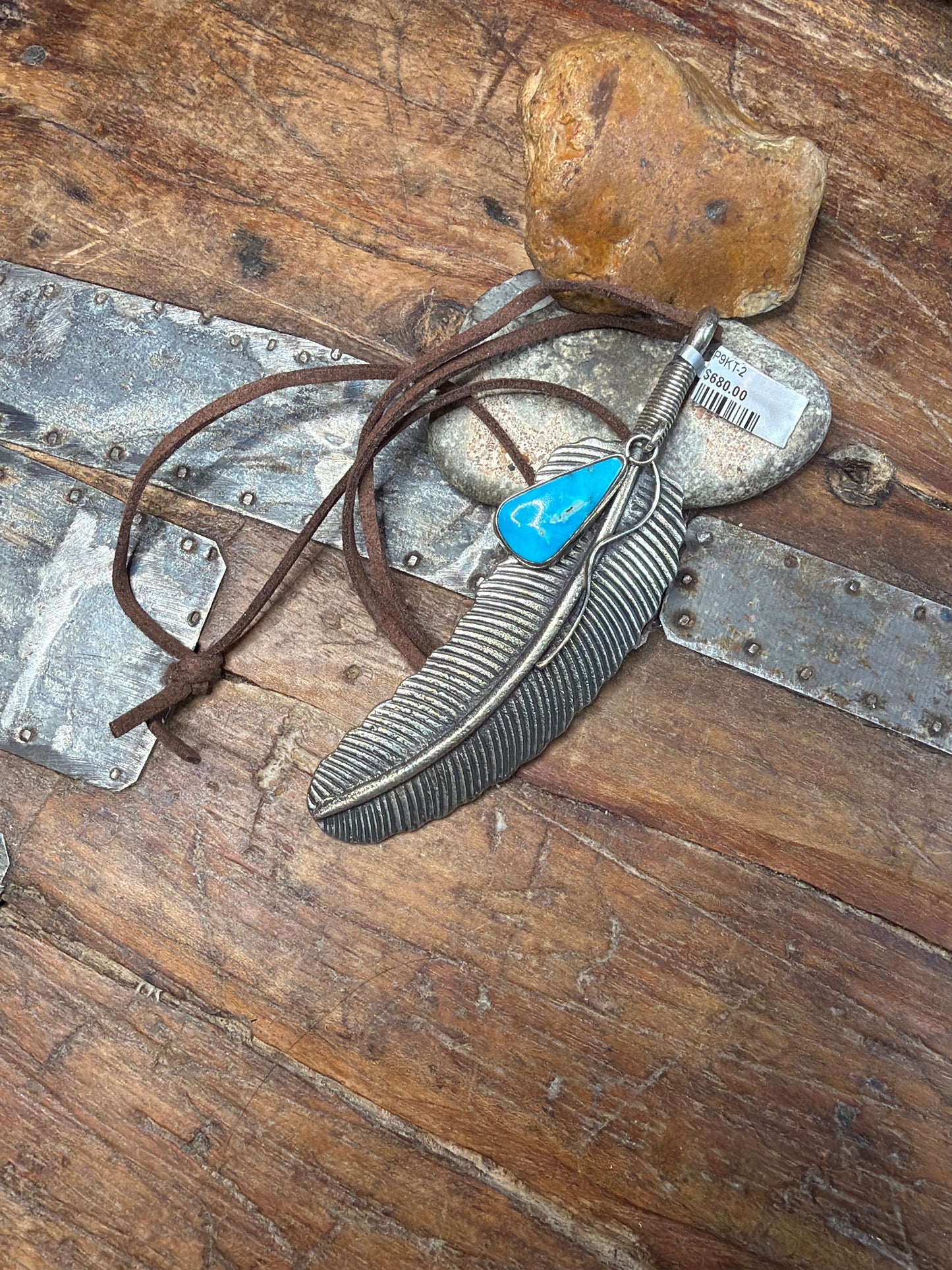 Feather necklace with charm
