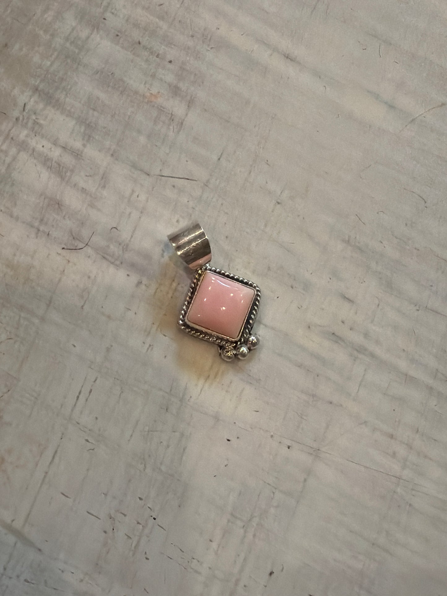 Ami potts-pink conch pendant