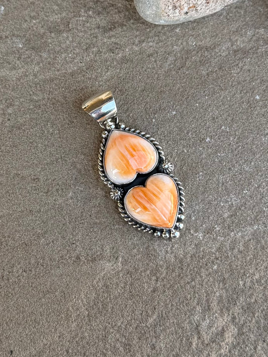 Orange spiny double heart pendant