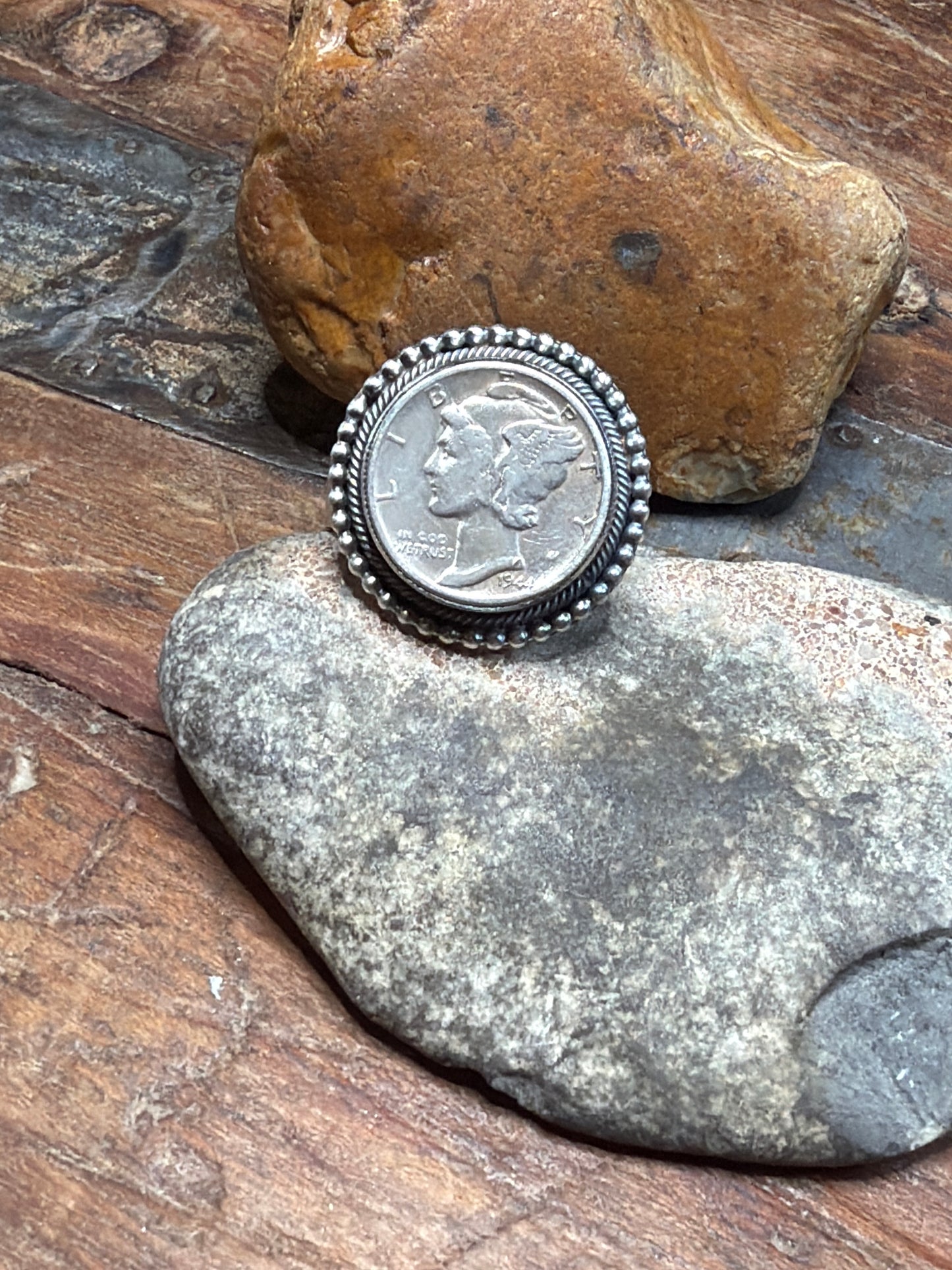Gracie coin, ring adjustable size to an eight stamped by the artist 1944