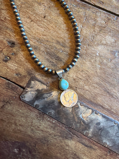 Devin 5 mm machine made beads 18 inches long with lobster closure and coin pendant with stone stamped by the artist(pendant)