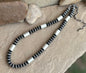 Sterling saucer and tube necklace